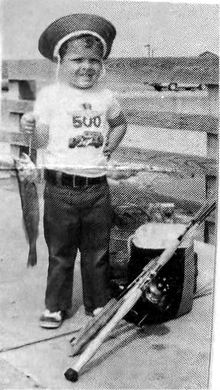 Ken Gavranovic at age 4 holding a sandtrout on the Gulf Coast Fishing Pier in Galveston, Texas, pictured in Pier Sportfishing News, October 15, 1974