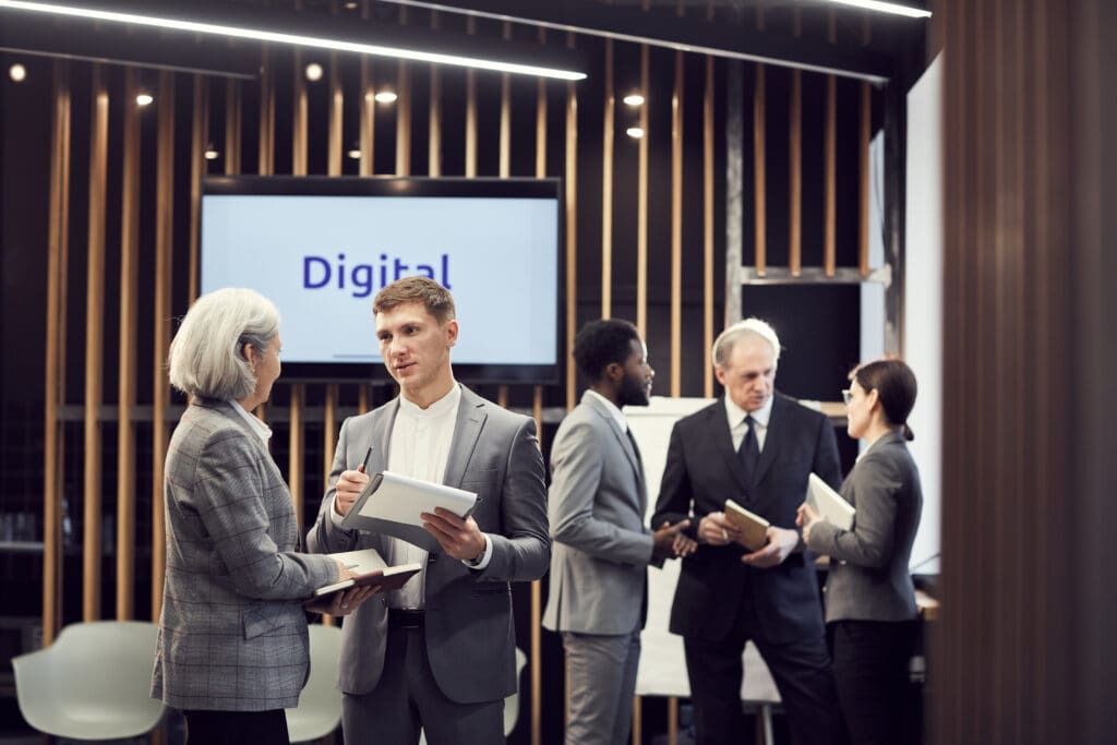 Digital Business People Chatting in a Room